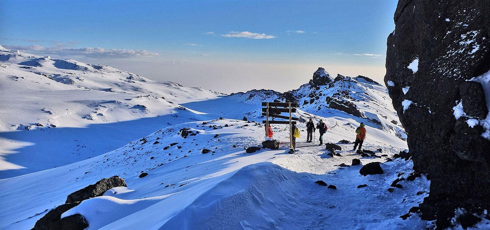 Climbers on the snowy summit of Kilimanjaro